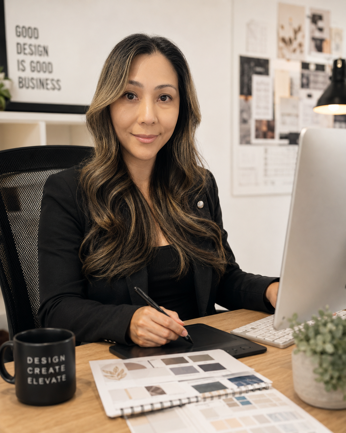 Sandy Riopel working on graphic design at LUCKI MEDIA
